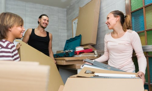 Professional packers organizing items for a move in Storage Kennington