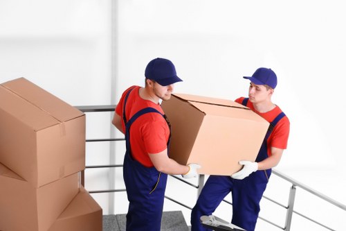 Professional movers assisting with loading items into a van