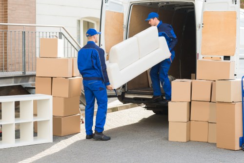 Customer receiving assistance from a man with a van