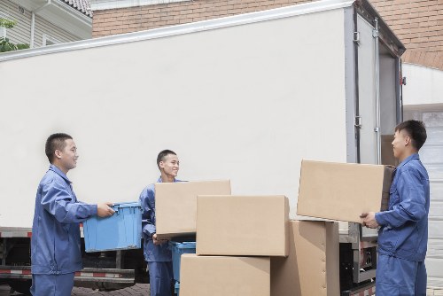 Professional movers handling furniture during a move